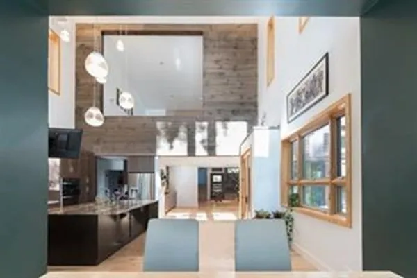 a view of a living room and kitchen with furniture