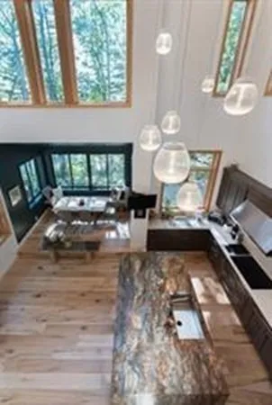a view of a living room and a wooden floor