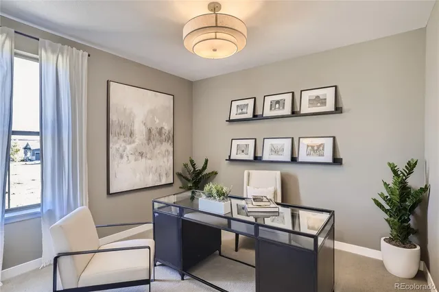 a view of a livingroom with furniture and window