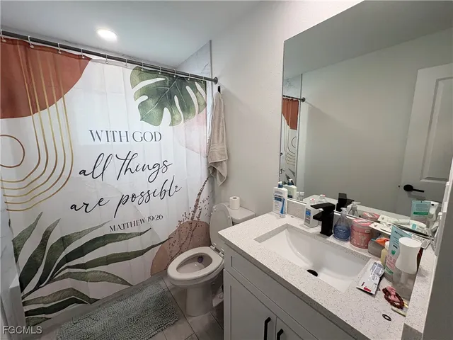 a bedroom with bed and glass windows
