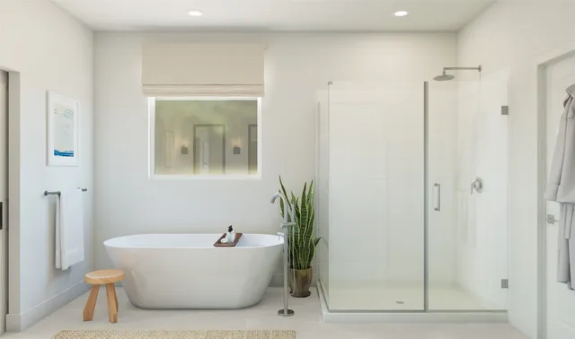 a white tub sitting next to a shower