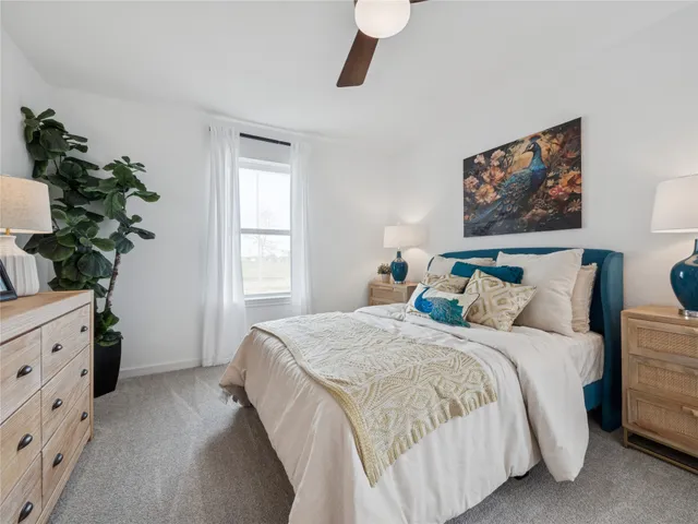 a bedroom with bed and window