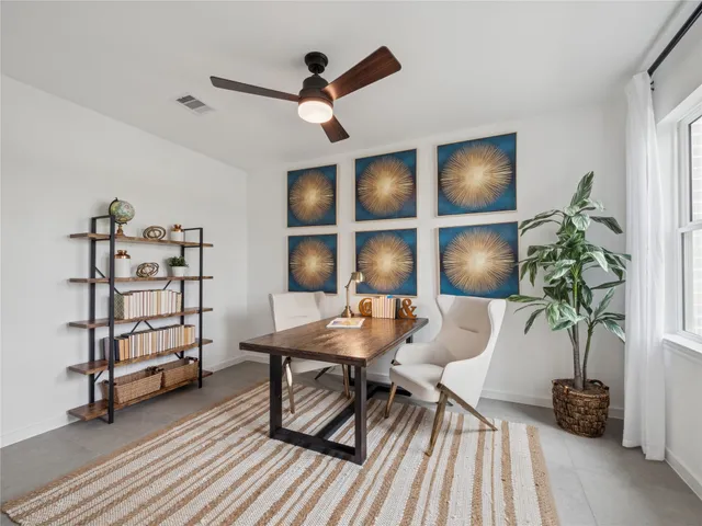 a workspace with furniture and a potted plant