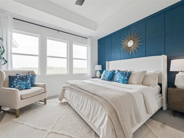 a bedroom with bed and window