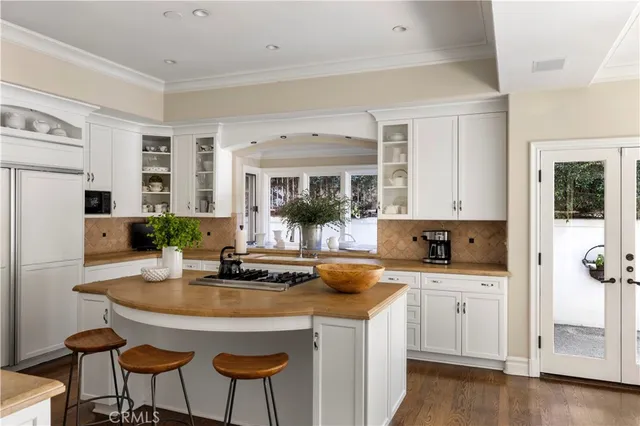 a kitchen with a sink stove and refrigerator