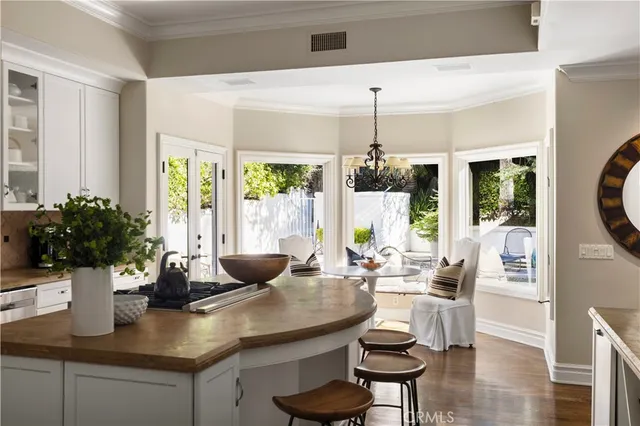 a view of a kitchen with granite countertop potted plants