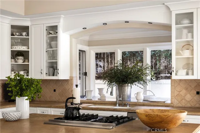 a view of a dining room with furniture wooden floor and chandelier