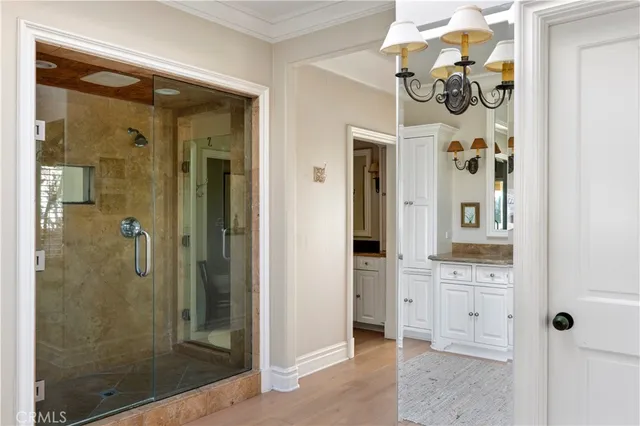 a bathroom with a granite countertop sink vanity and mirror