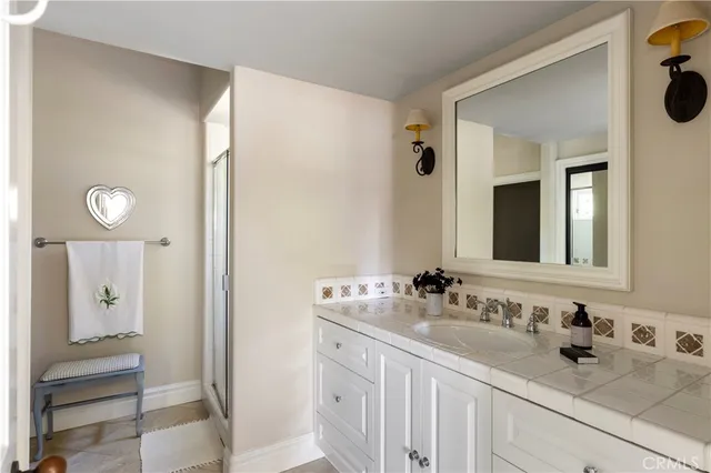 a view of a hallway with closet and bathroom