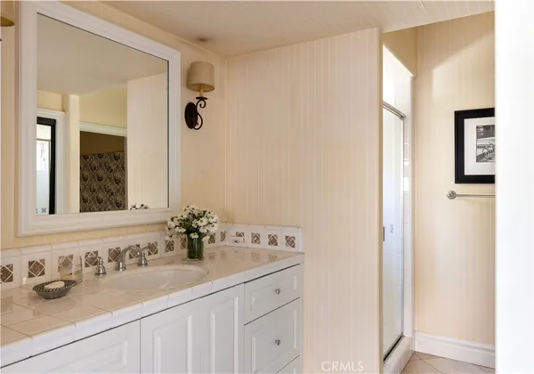 a bedroom with furniture and flat screen tv
