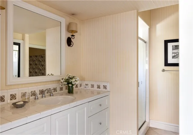 a bedroom with furniture and flat screen tv