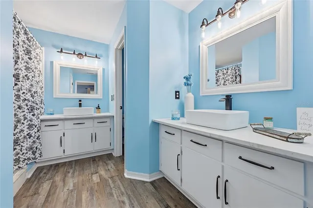 a bathroom with a sink and a mirror