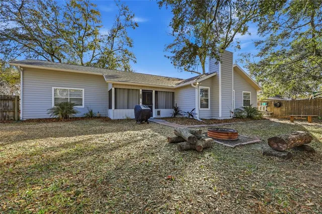 a backyard of a house with seating space