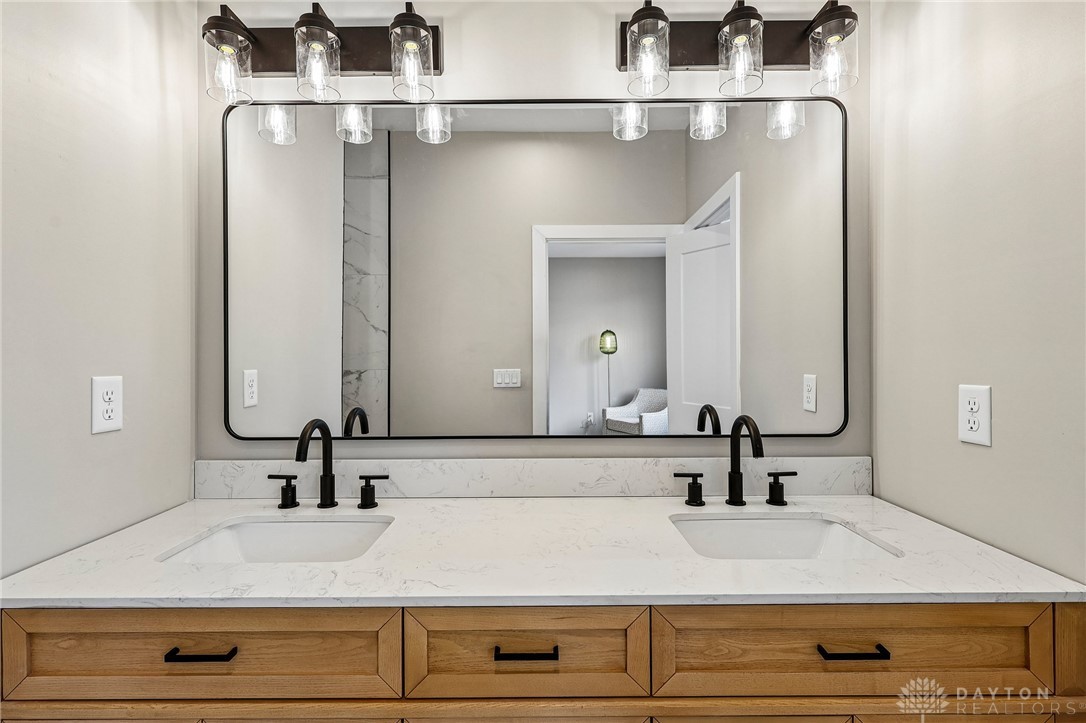 3906 Edwards Road, Unit C Cincinnati, OH 45209 - Photo 32 of 46 This primary bathroom offers a dual vanity with ample counter space and elegant fixtures.