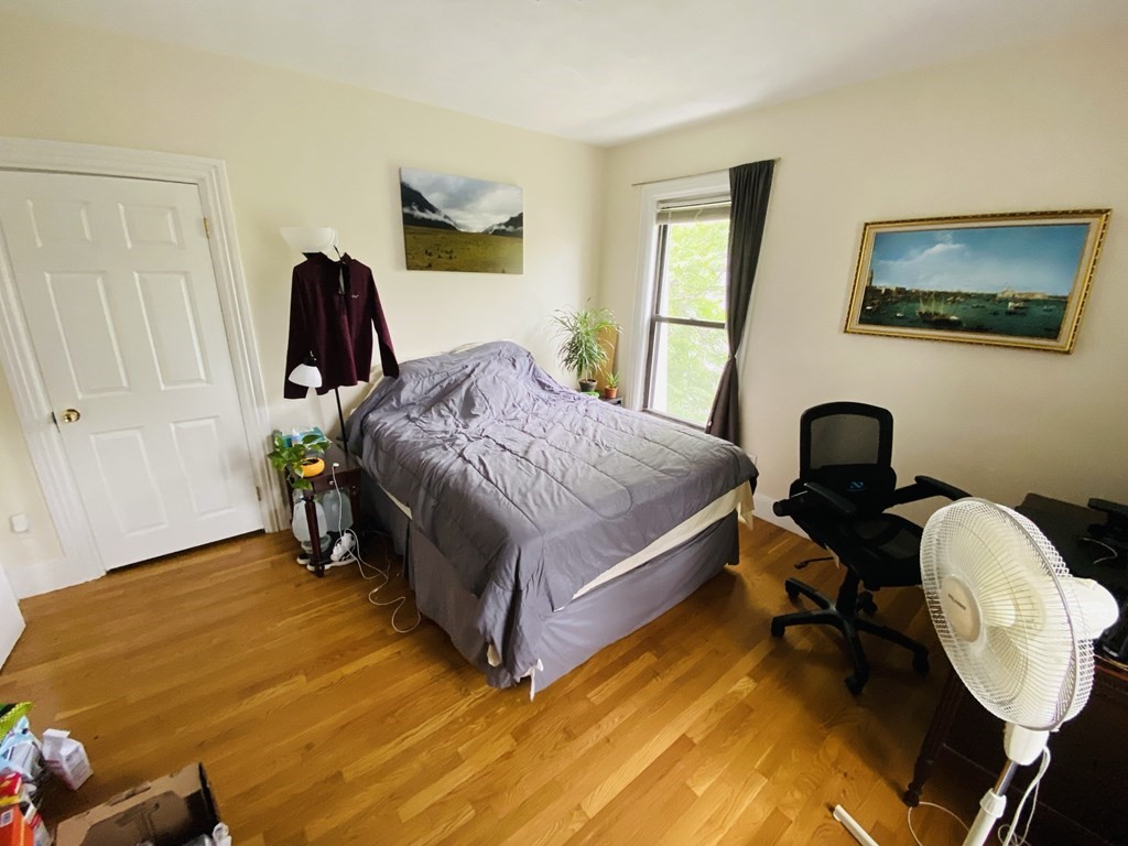 48 Allston Street, Unit 2 Boston, MA 02134 - Photo 12 of 24 a bedroom with a bed and a mirror