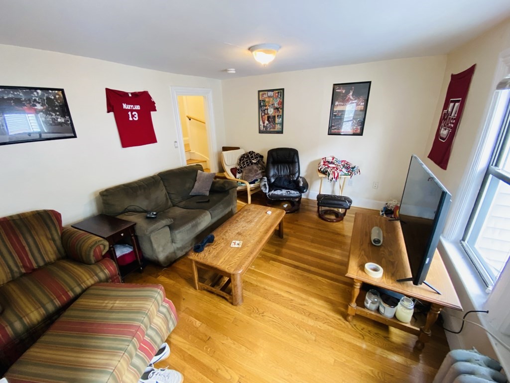 48 Allston Street, Unit 2 Boston, MA 02134 - Photo 15 of 24 a living room with furniture and a flat screen tv