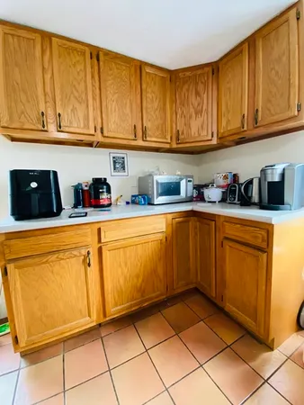 a kitchen with stainless steel appliances granite countertop a sink and cabinets