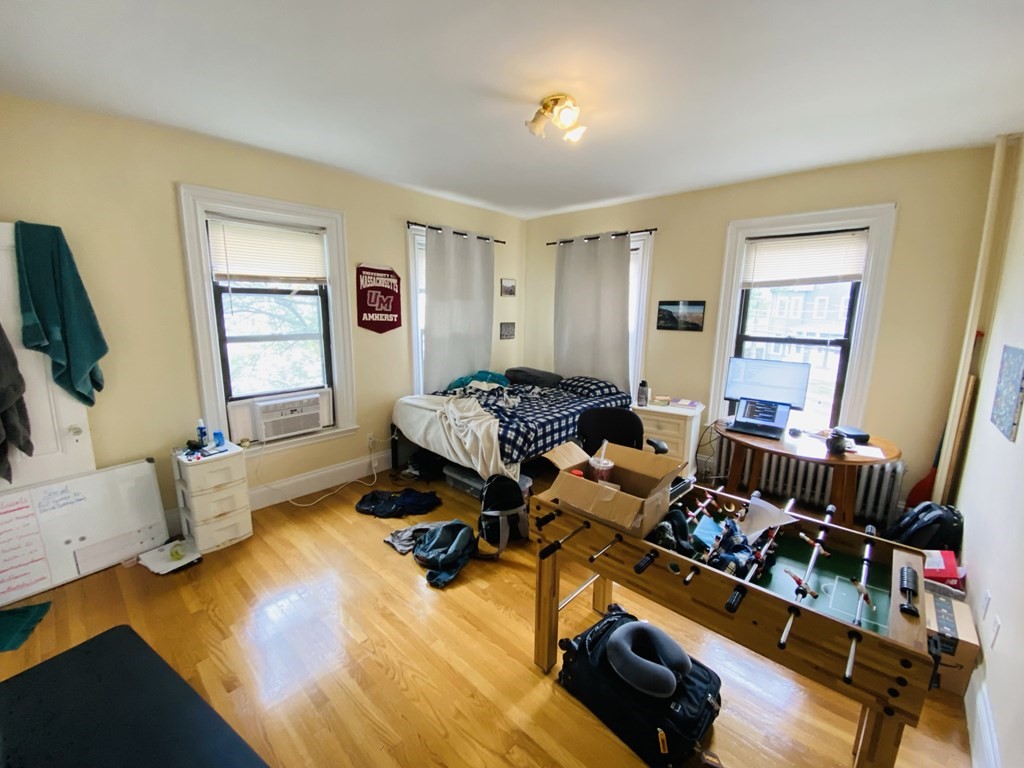 48 Allston Street, Unit 2 Boston, MA 02134 - Photo 2 of 24 a living room with furniture and a flat screen tv