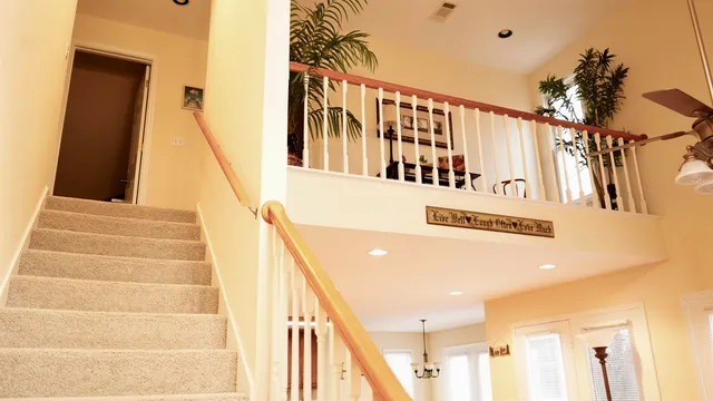 a view of staircase with white walls