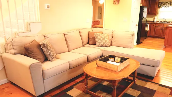 a living room with furniture and a table