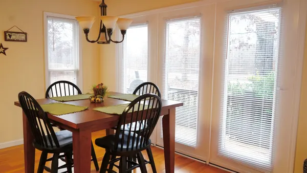 a view of a dining room with furniture window and outside view