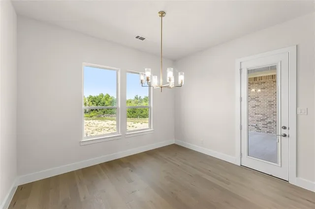 a bathroom with a bathtub sink mirror and shower