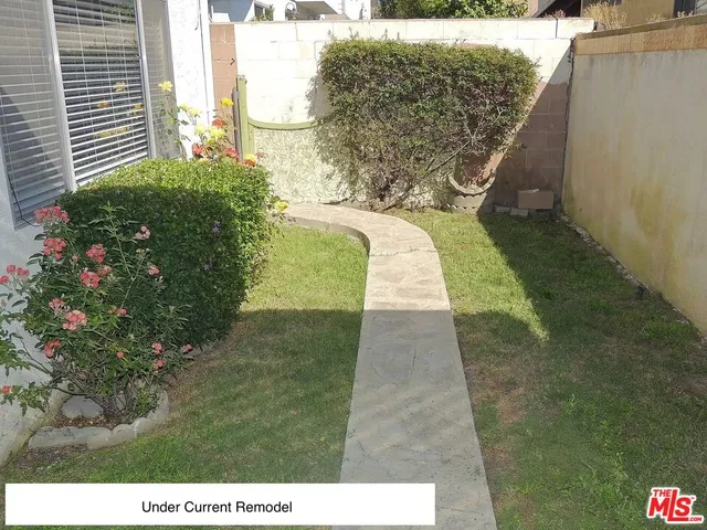 a view of swimming pool with a yard