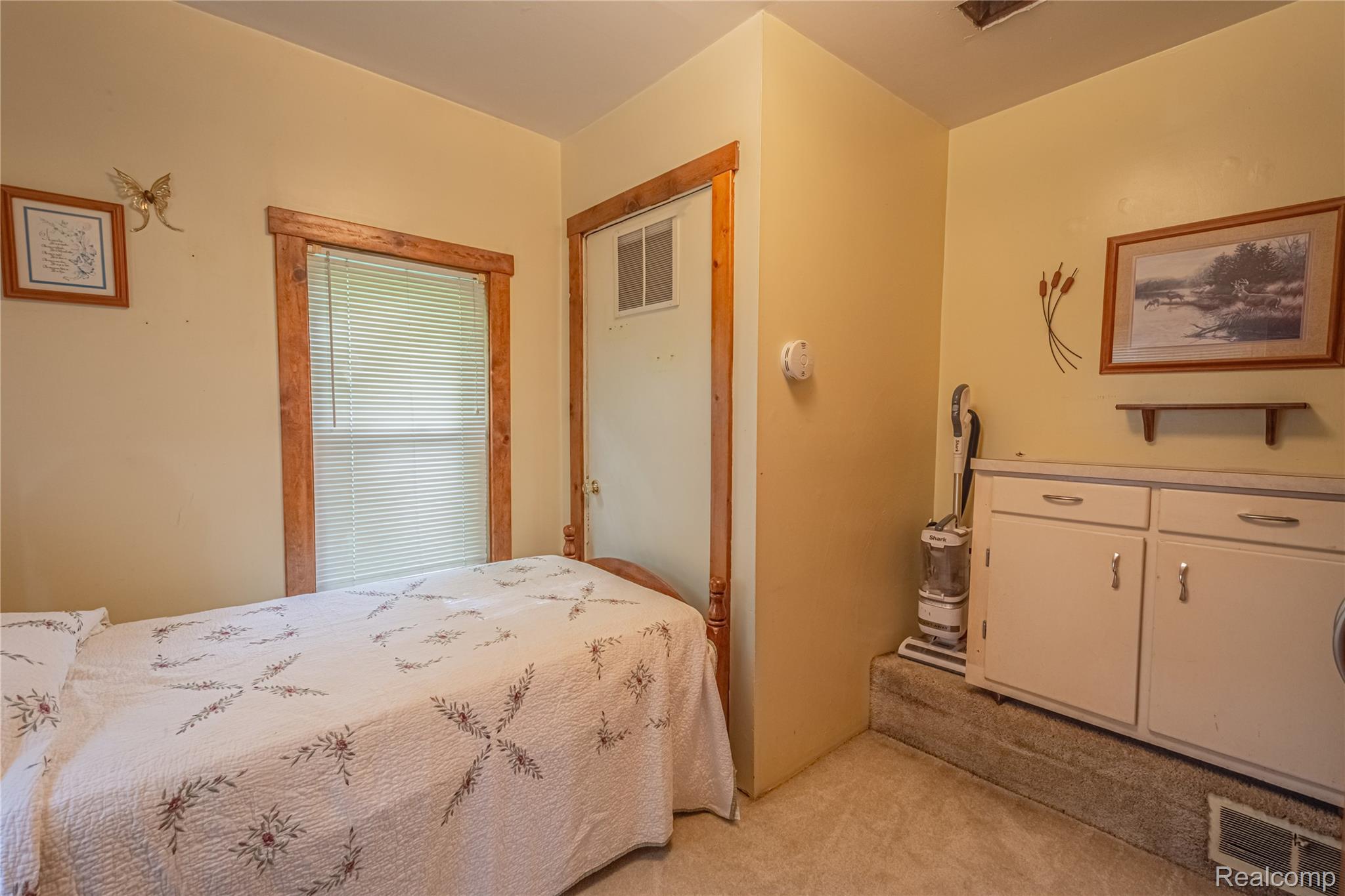 8384 Imlay City Road Avoca, MI 48006 - Photo 32 of 39 Room featuring light-toned walls and wood-trimmed window