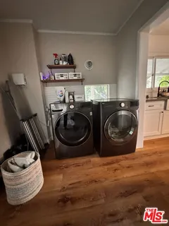 a kitchen with a refrigerator and a stove