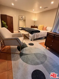 a living room with furniture and a lamp