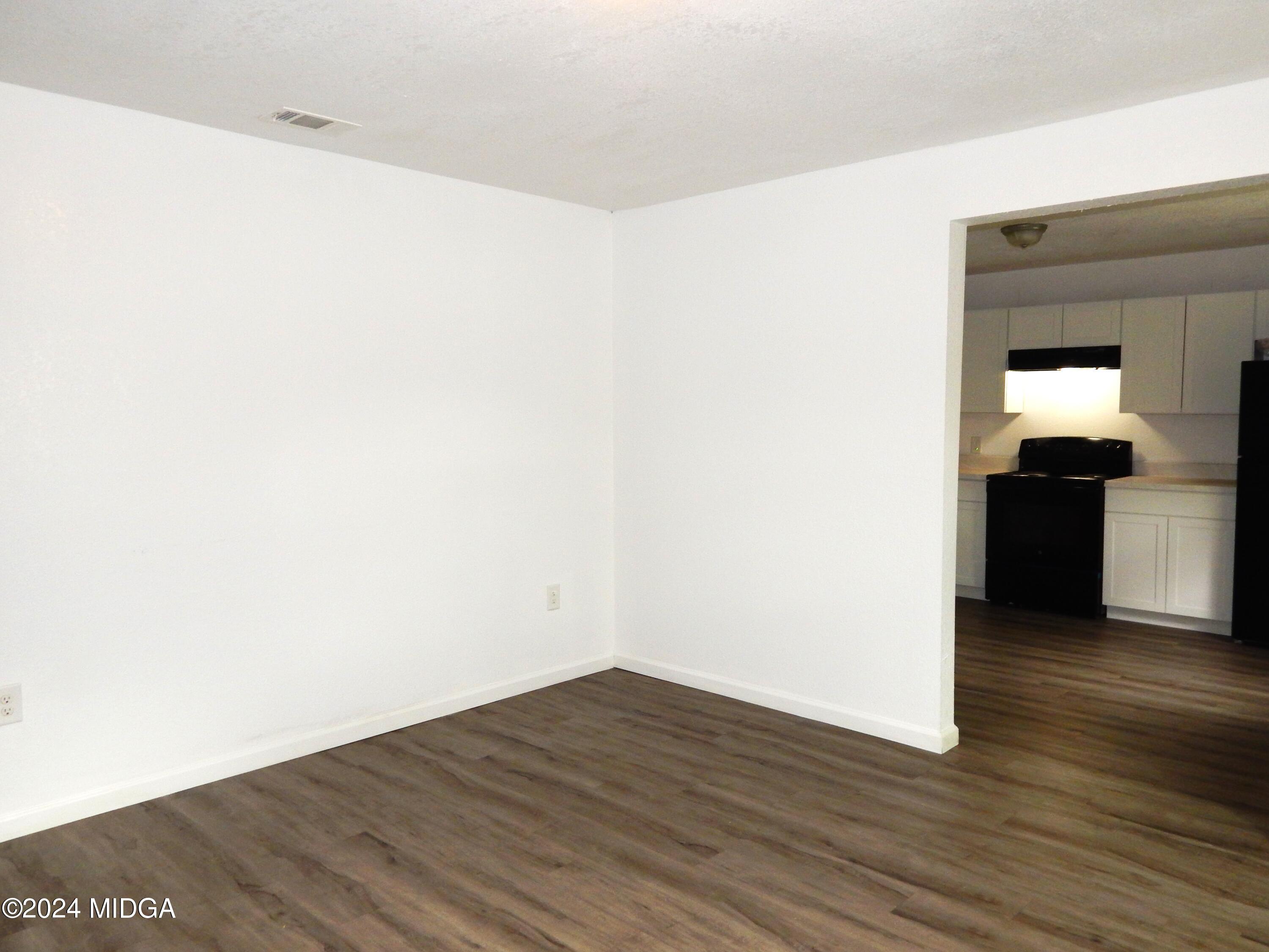 3835 Kings Park Circle Macon, GA 31217 - Photo 3 of 15 a view of a kitchen with wooden floor and a sink