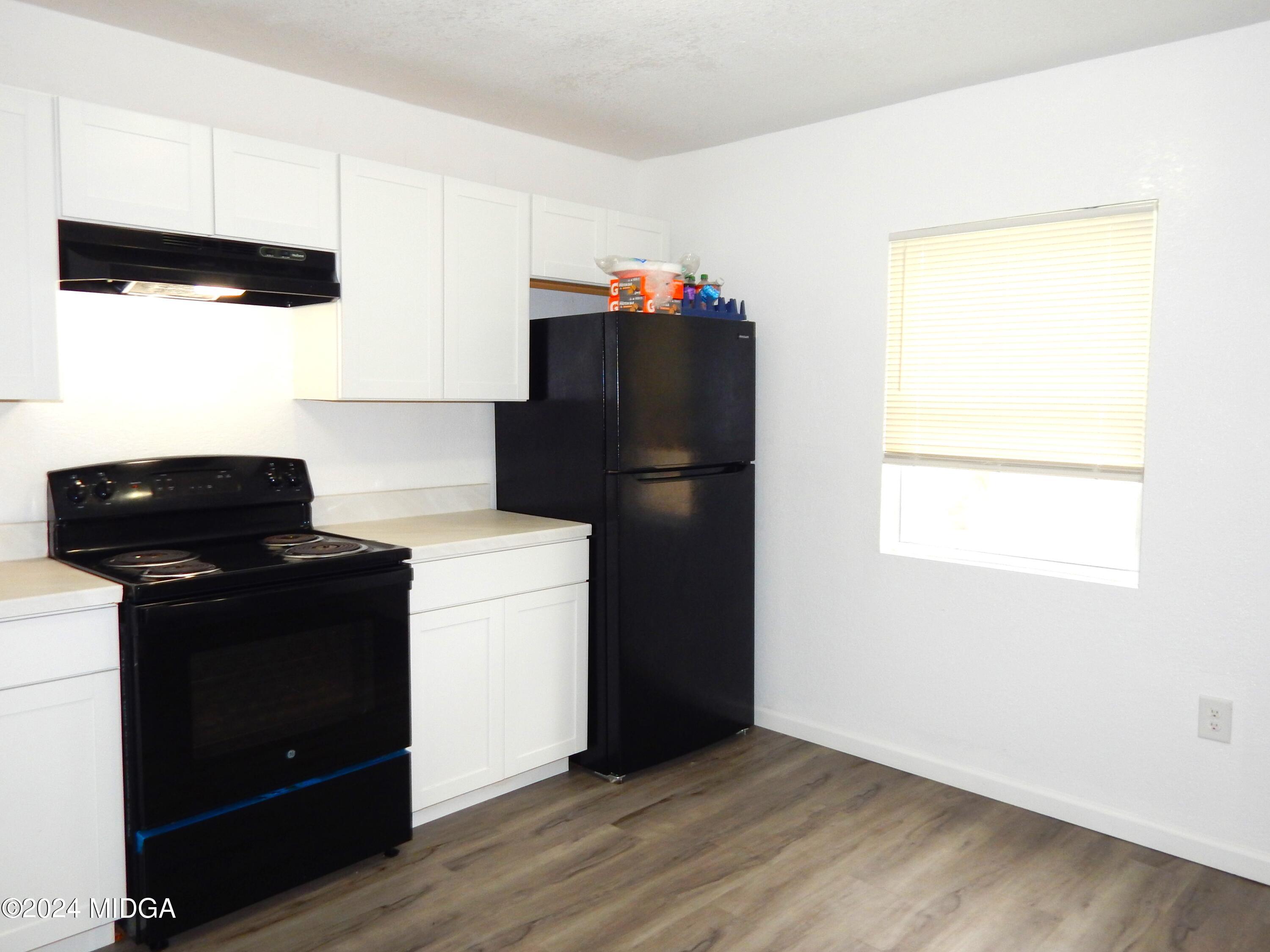 3835 Kings Park Circle Macon, GA 31217 - Photo 7 of 15 a kitchen with a refrigerator and a stove