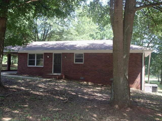 a view of house with outdoor space