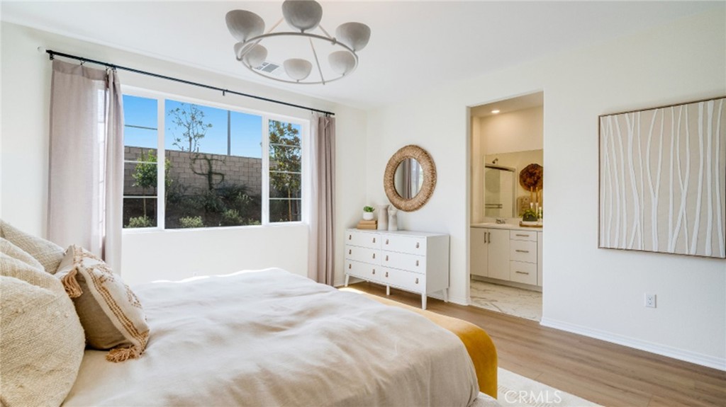 366 Sea Bright Road Perris, CA 92570 - Photo 12 of 21 a bedroom with a bed a mirror and window