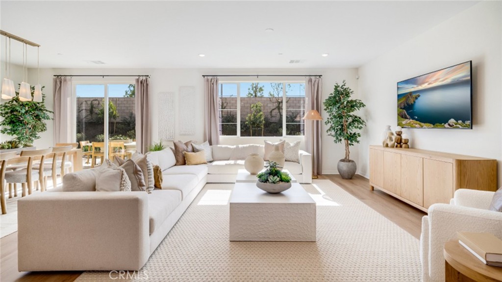 366 Sea Bright Road Perris, CA 92570 - Photo 5 of 21 a living room with furniture and a flat screen tv