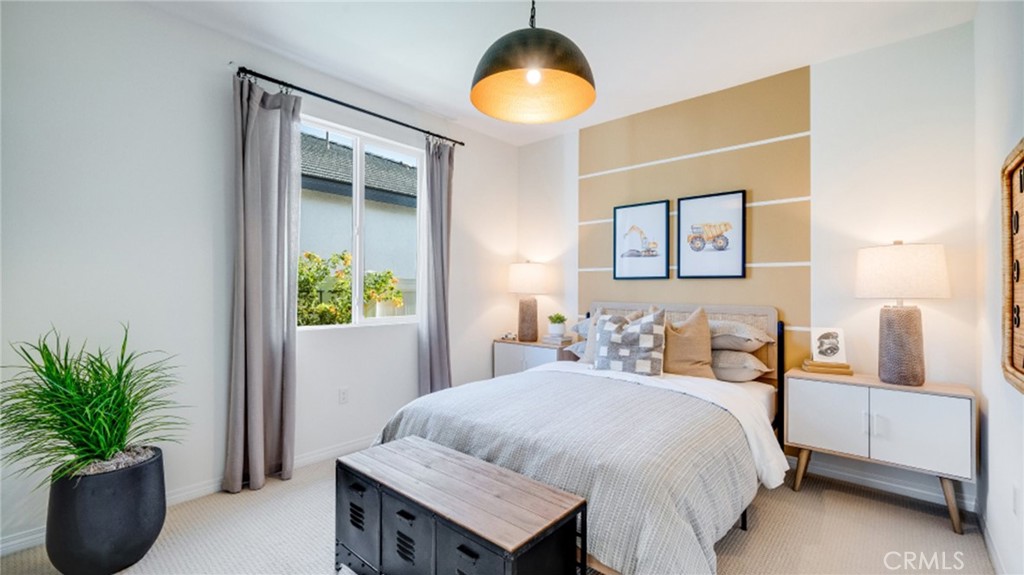 366 Sea Bright Road Perris, CA 92570 - Photo 10 of 21 a bedroom with a bed and a potted plant