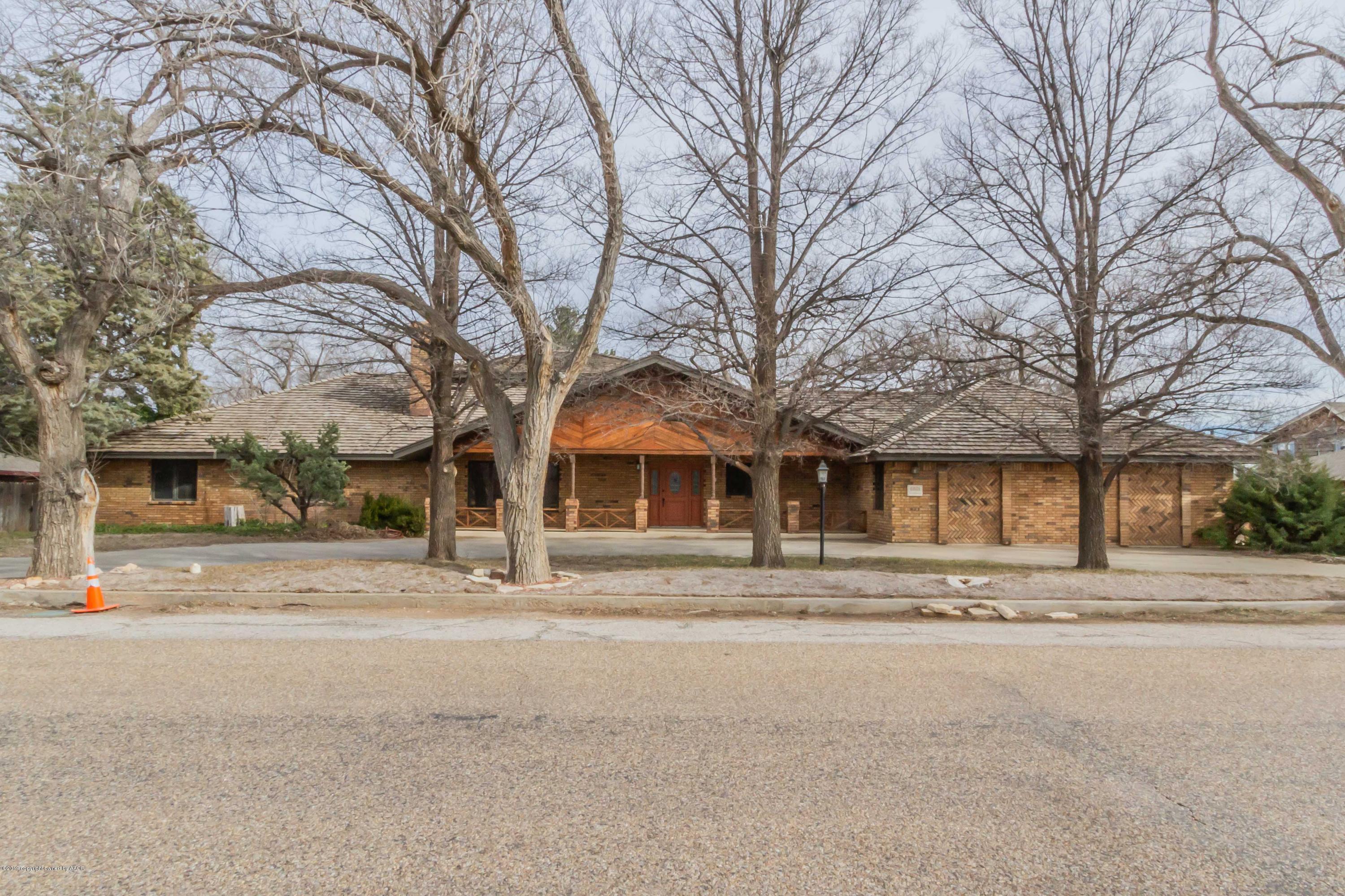 6801 Green Haven Road Amarillo, TX 79110 - Photo 2 of 65 front view of a house with a trees