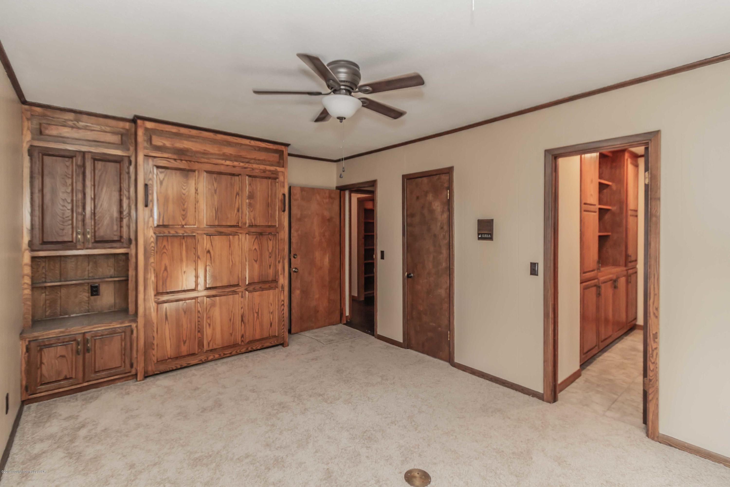 6801 Green Haven Road Amarillo, TX 79110 - Photo 25 of 65 a view of an empty room with a ceiling fan