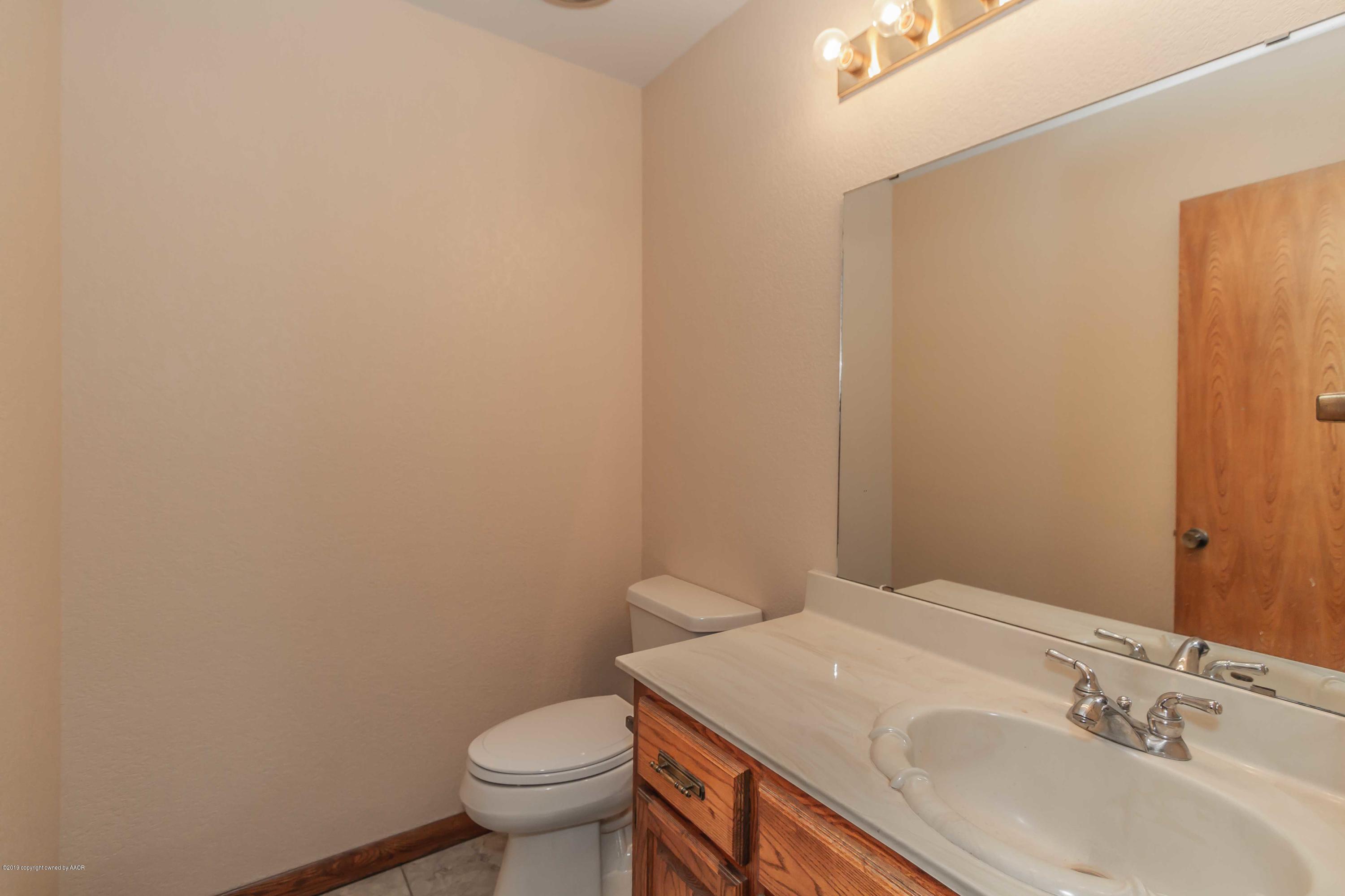 6801 Green Haven Road Amarillo, TX 79110 - Photo 46 of 65 a bathroom with a sink and a toilet