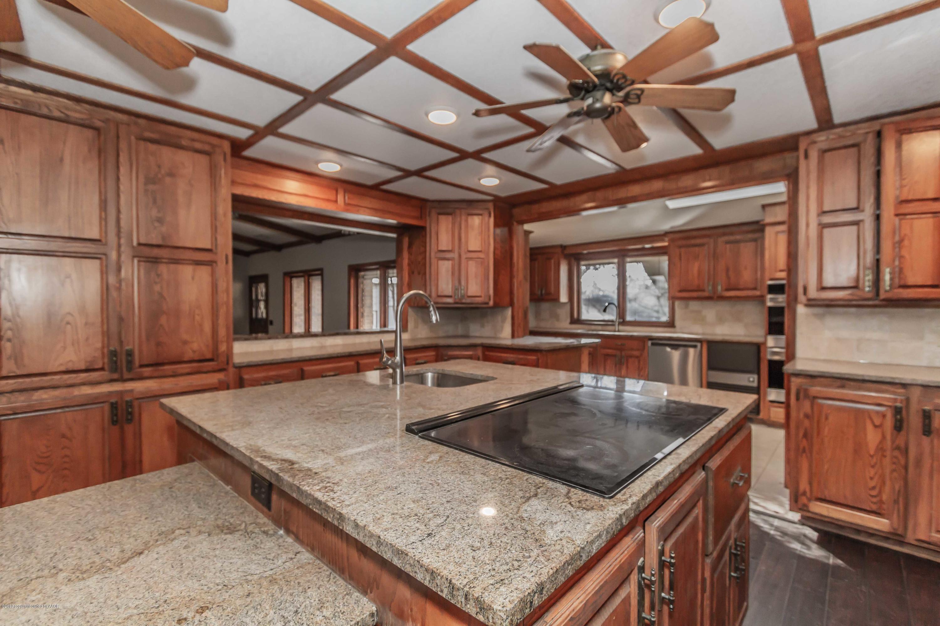 6801 Green Haven Road Amarillo, TX 79110 - Photo 7 of 65 a kitchen with stainless steel appliances granite countertop a sink a oven and a counter top space