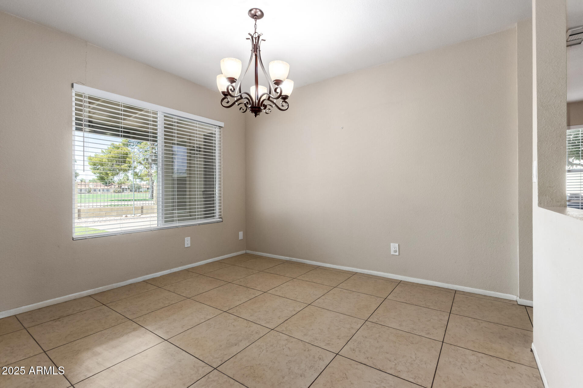 7412 East Ed Rice Avenue Mesa, AZ 85208 - Photo 11 of 36 a view of an empty room with a window