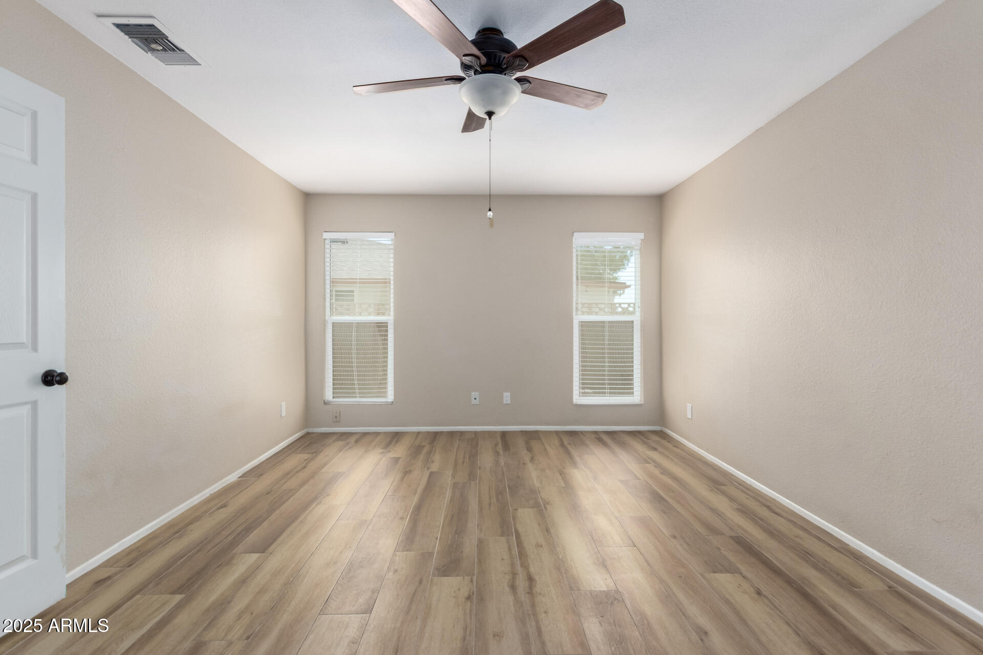 7412 East Ed Rice Avenue Mesa, AZ 85208 - Photo 21 of 36 wooden floor in an empty room with a window