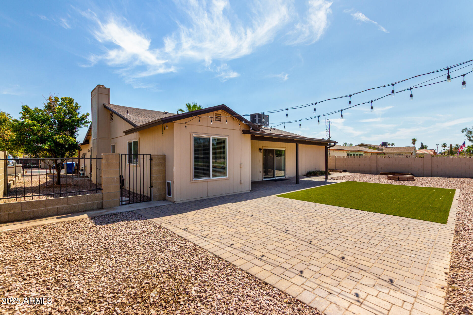 7412 East Ed Rice Avenue Mesa, AZ 85208 - Photo 34 of 36 a front view of a house with a yard and garage
