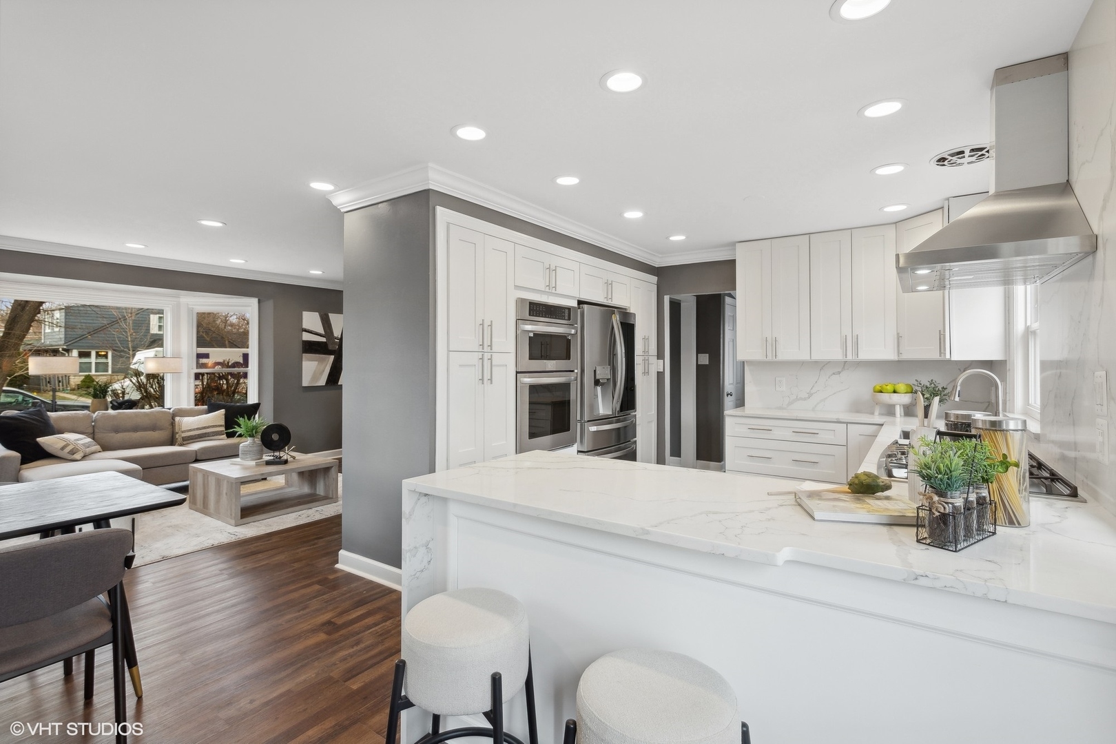 8501 Harding Avenue Skokie, IL 60076 - Photo 11 of 37 a living room with kitchen island granite countertop furniture and a wooden floor