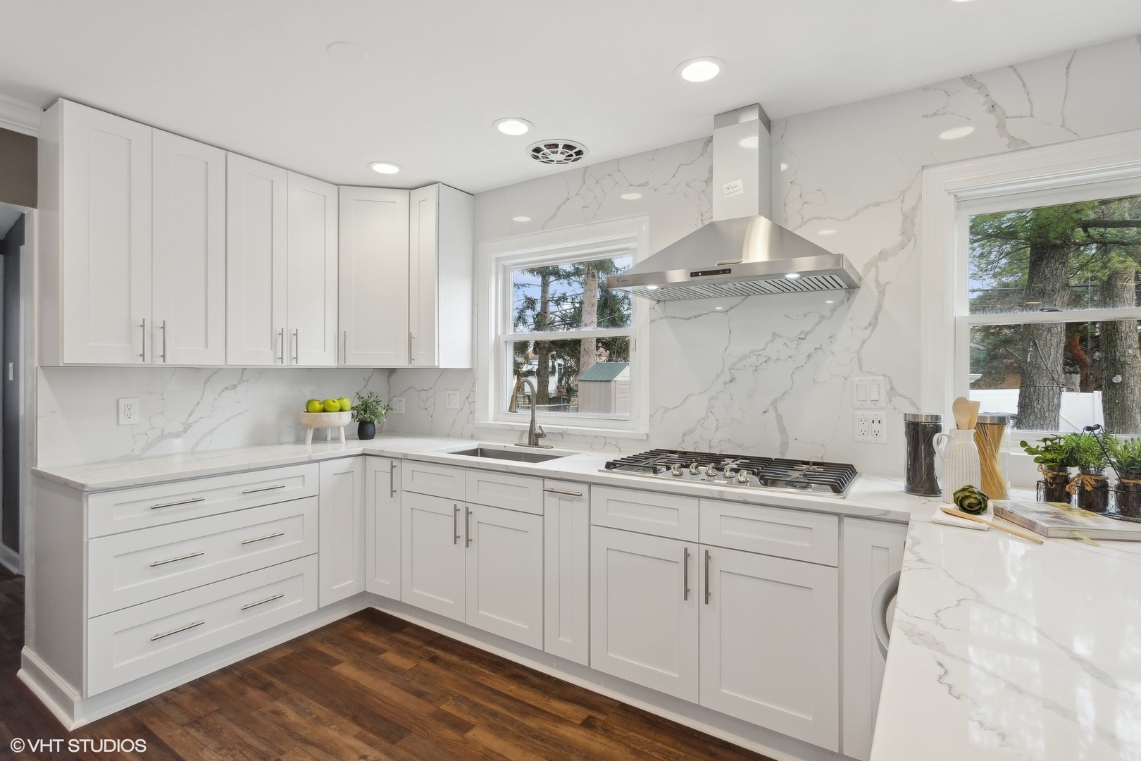 8501 Harding Avenue Skokie, IL 60076 - Photo 12 of 37 a kitchen with a stove cabinets and wooden floor