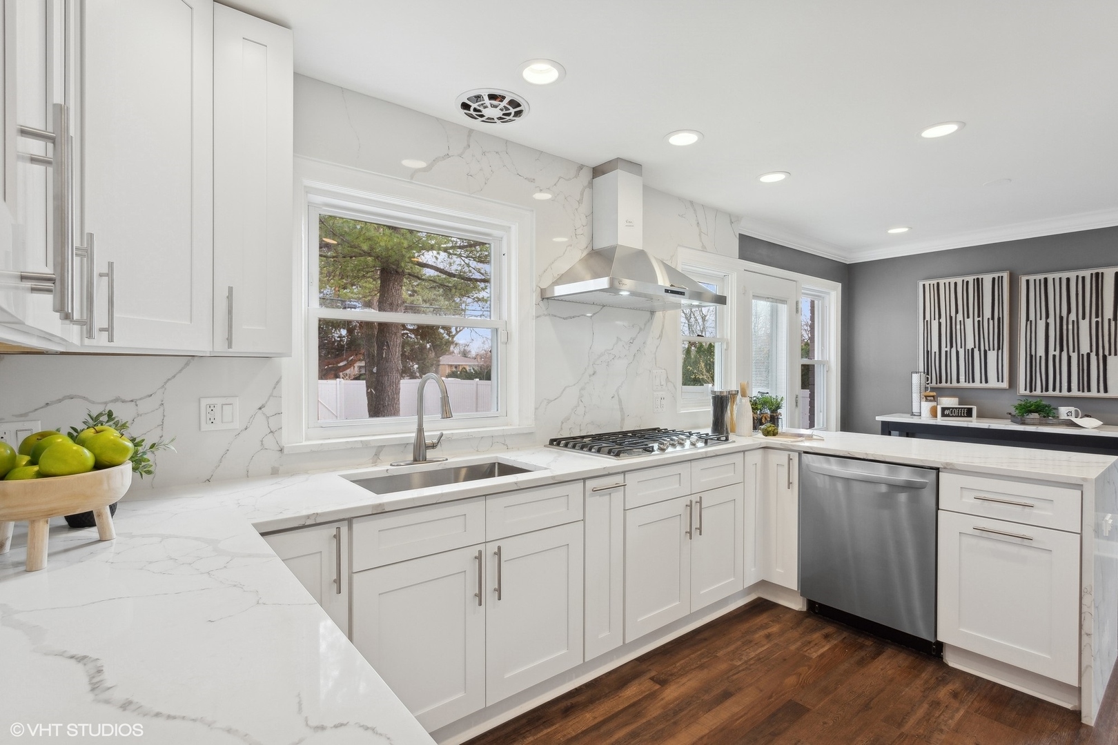 8501 Harding Avenue Skokie, IL 60076 - Photo 14 of 37 a kitchen with a sink cabinets and window