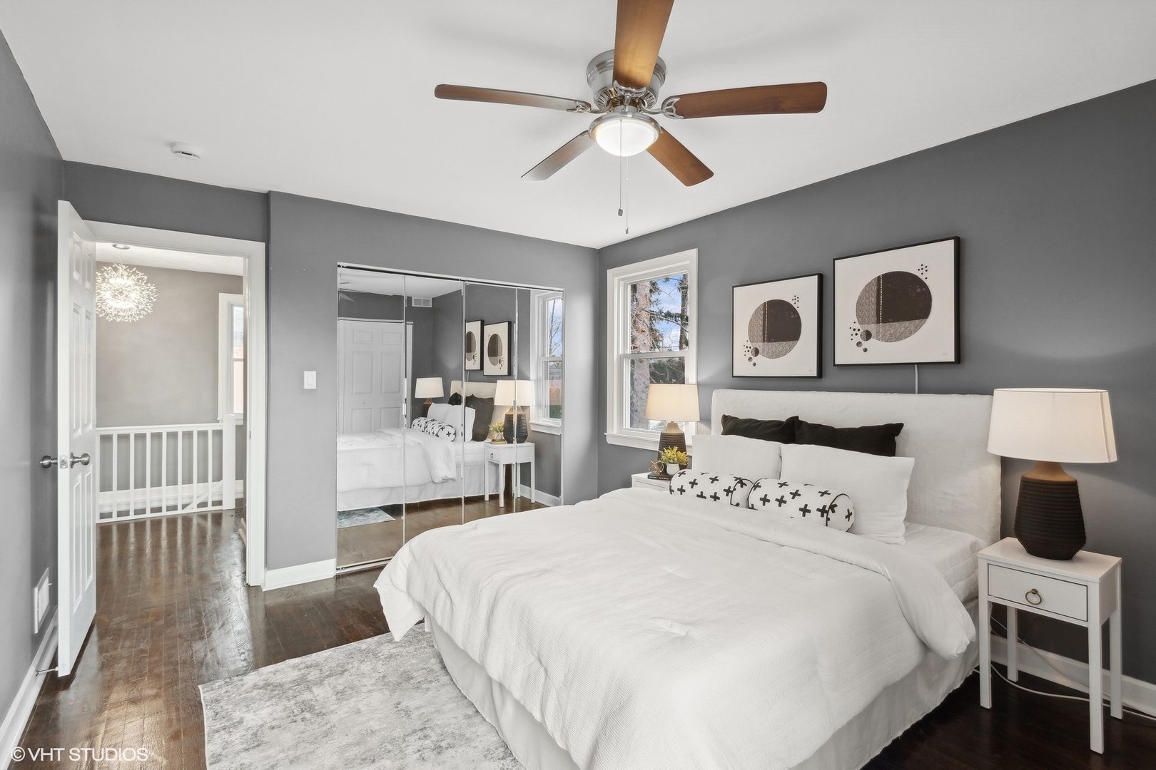 8501 Harding Avenue Skokie, IL 60076 - Photo 19 of 37 a bedroom with a large bed and a chandelier