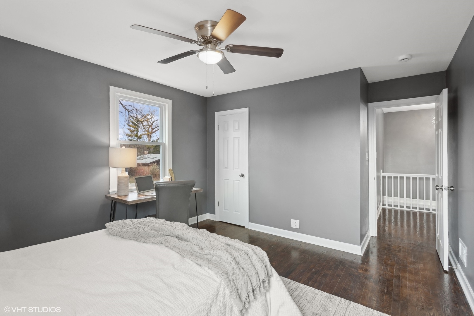 8501 Harding Avenue Skokie, IL 60076 - Photo 21 of 37 a bedroom with a bed and a chandelier