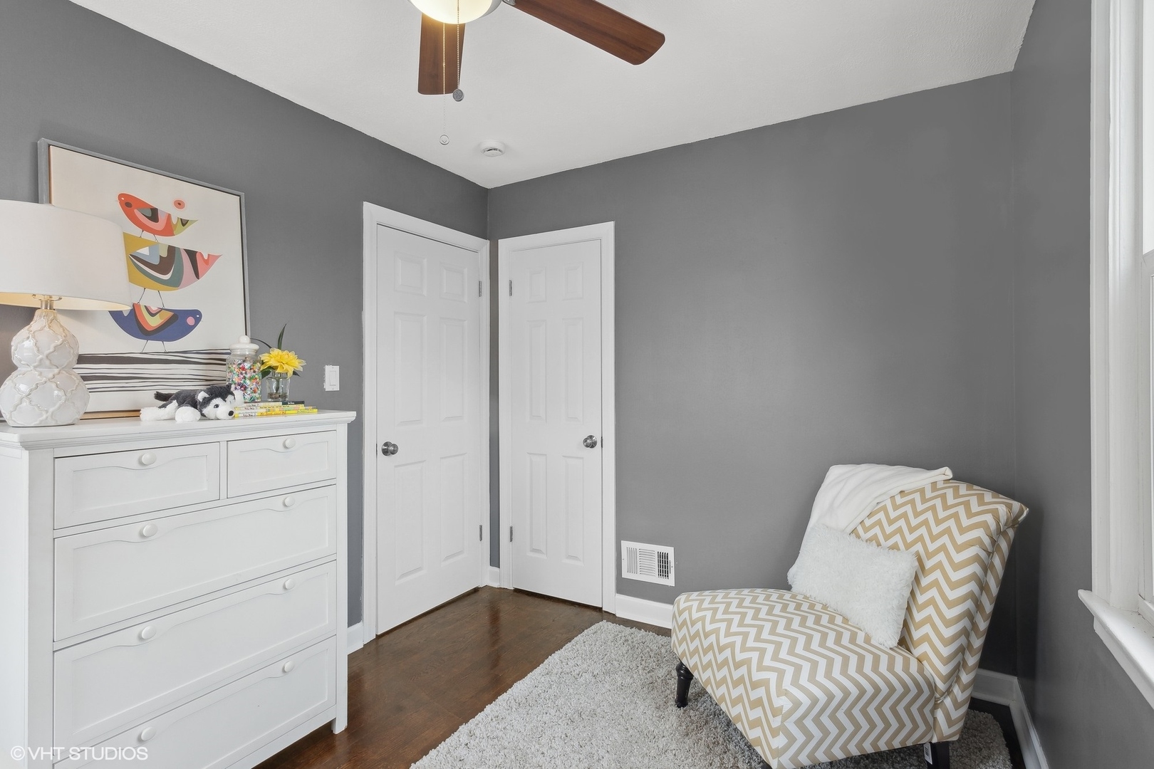 8501 Harding Avenue Skokie, IL 60076 - Photo 23 of 37 a bedroom with a bed and cupboard