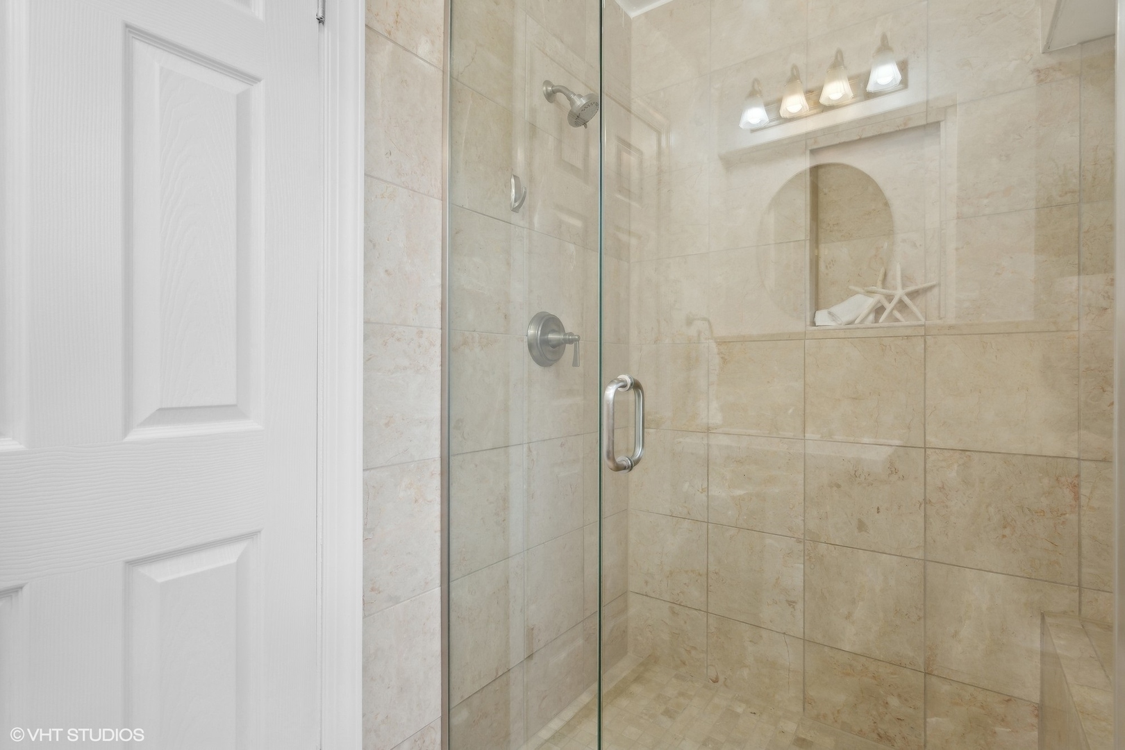 8501 Harding Avenue Skokie, IL 60076 - Photo 25 of 37 a bathroom with a mirror shower vanity and a sink